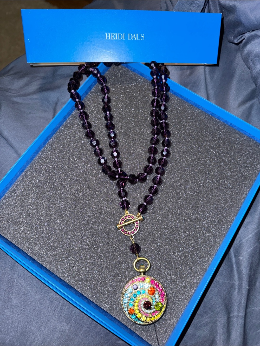 Heidi Daus Purple Crystal Bead Necklace with Multicolor Swirl Pendant.